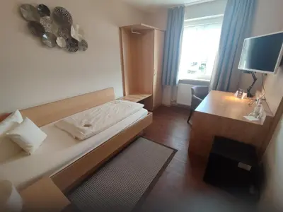 Ein Bett oder Betten in einem Zimmer der Unterkunft Hotel Landgasthof Euringer