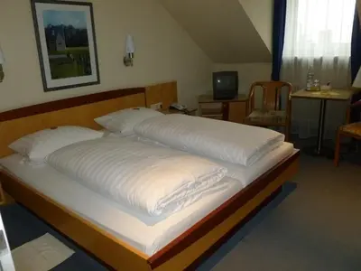 Ein Bett oder Betten in einem Zimmer der Unterkunft Hotel Hauser an der Universität