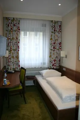 Ein Bett oder Betten in einem Zimmer der Unterkunft Hotel Hauser an der Universität