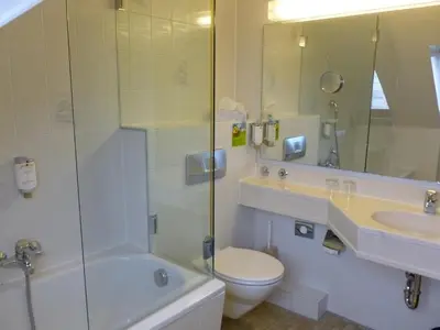 Ein Badezimmer in der Unterkunft Hotel Hauser an der Universität