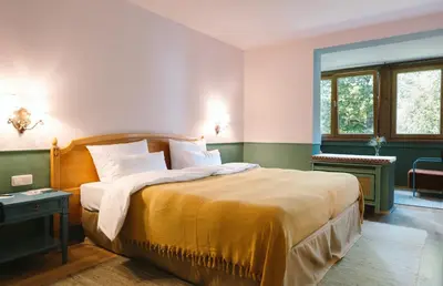 Ein Bett oder Betten in einem Zimmer der Unterkunft HENRI Hotel Garmisch-Partenkirchen