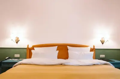 Ein Bett oder Betten in einem Zimmer der Unterkunft HENRI Hotel Garmisch-Partenkirchen