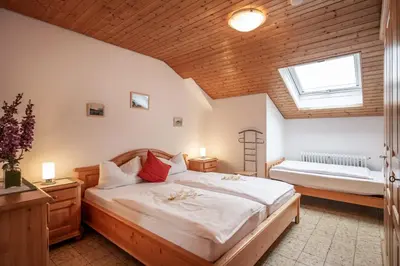 Ein Bett oder Betten in einem Zimmer der Unterkunft Ferienwohnanlage Oberaudorf F7 mit Hallenbad und Sauna