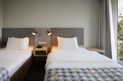 Ein Bett oder Betten in einem Zimmer der Unterkunft Holiday Inn Munich - South by IHG