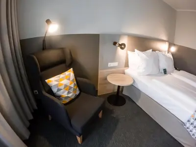 Ein Bett oder Betten in einem Zimmer der Unterkunft Holiday Inn Munich - South by IHG
