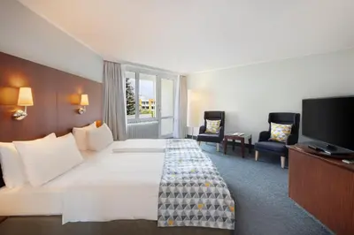 Ein Bett oder Betten in einem Zimmer der Unterkunft Holiday Inn Munich - South by IHG