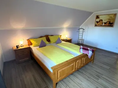 Ein Bett oder Betten in einem Zimmer der Unterkunft Ferienwohnungen Roiser