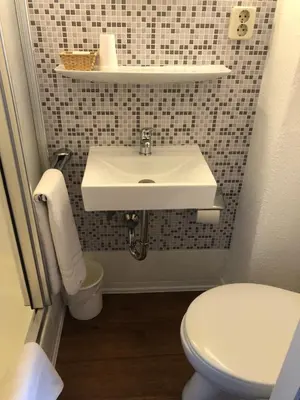 Ein Badezimmer in der Unterkunft Hotel Galleria