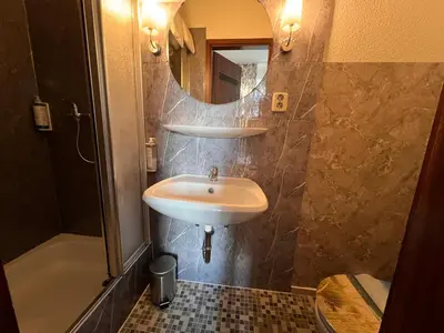 Ein Badezimmer in der Unterkunft Hotel Galleria