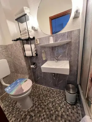 Ein Badezimmer in der Unterkunft Hotel Galleria
