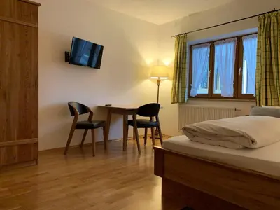 Ein Bett oder Betten in einem Zimmer der Unterkunft Zum Dammerbauer