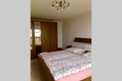 Ein Bett oder Betten in einem Zimmer der Unterkunft PRIEN Spacious Roof Top Maisonett Apartment at Lake Chiemsee
