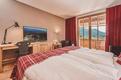 Ein Bett oder Betten in einem Zimmer der Unterkunft Das Achental Resort