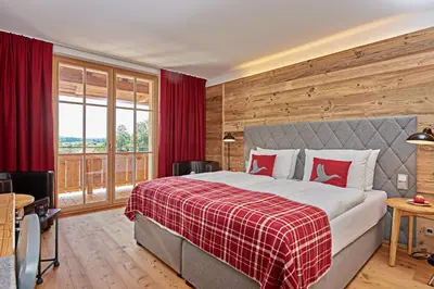 Ein Bett oder Betten in einem Zimmer der Unterkunft Das Achental Resort