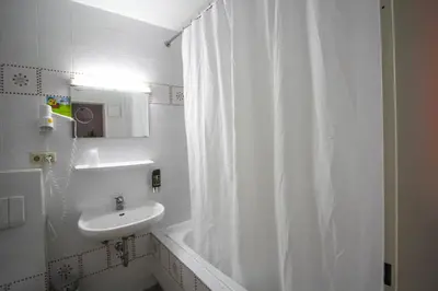 Ein Badezimmer in der Unterkunft Hotel Seibel