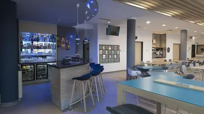 Ein Restaurant oder anderes Speiselokal in der Unterkunft Holiday Inn Express München Messe by IHG