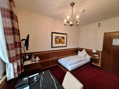 Ein Bett oder Betten in einem Zimmer der Unterkunft Romantik Hotel Das Lindner