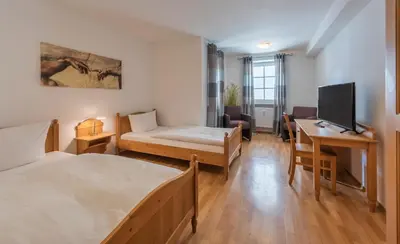 Ein Bett oder Betten in einem Zimmer der Unterkunft Hotel Wirt z´ Engelsberg