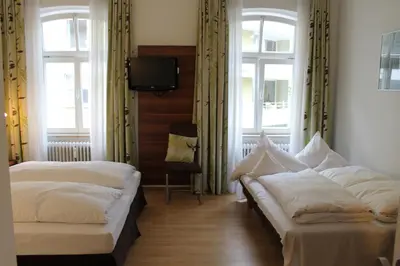 Ein Bett oder Betten in einem Zimmer der Unterkunft Hotel am Viktualienmarkt