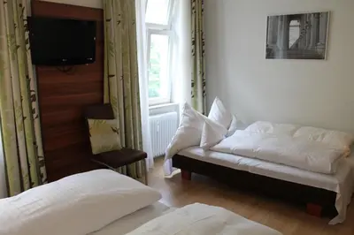 Ein Bett oder Betten in einem Zimmer der Unterkunft Hotel am Viktualienmarkt