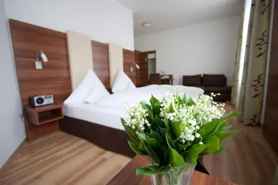 Ein Bett oder Betten in einem Zimmer der Unterkunft Hotel am Viktualienmarkt