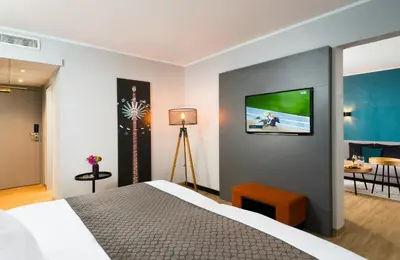 Ein Bett oder Betten in einem Zimmer der Unterkunft Leonardo Hotel Munich Arabellapark