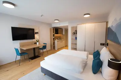 Ein Bett oder Betten in einem Zimmer der Unterkunft Leo Apartments Miesbach