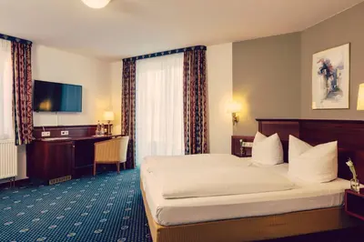Ein Bett oder Betten in einem Zimmer der Unterkunft Landhotel Hallnberg
