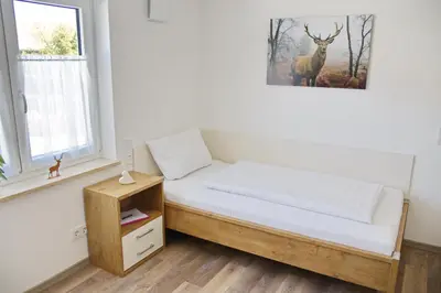 Ein Bett oder Betten in einem Zimmer der Unterkunft Boardinghouse Jungwirth-Wohnzeit
