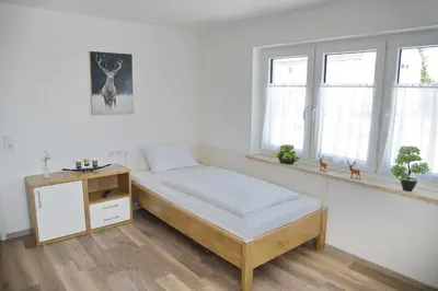 Ein Bett oder Betten in einem Zimmer der Unterkunft Boardinghouse Jungwirth-Wohnzeit