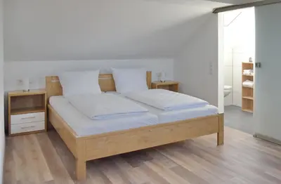 Ein Bett oder Betten in einem Zimmer der Unterkunft Boardinghouse Jungwirth-Wohnzeit