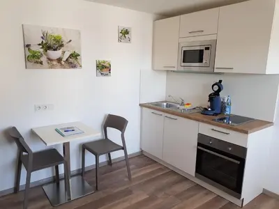 Küche/Küchenzeile in der Unterkunft Boardinghouse Jungwirth-Wohnzeit