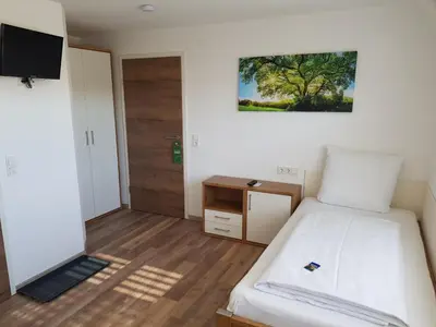 Ein Bett oder Betten in einem Zimmer der Unterkunft Boardinghouse Jungwirth-Wohnzeit