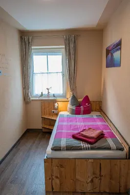 Ein Bett oder Betten in einem Zimmer der Unterkunft Pension Sengmüller