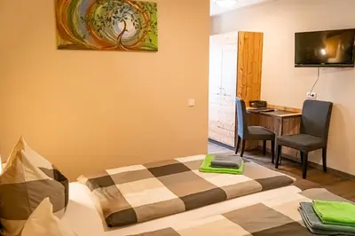 Ein Bett oder Betten in einem Zimmer der Unterkunft Pension Sengmüller