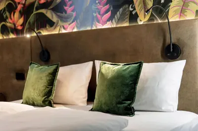 Ein Bett oder Betten in einem Zimmer der Unterkunft Rugs Hotel Augsburg, Trademark Collection by Wyndham