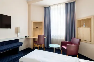 TV/Unterhaltungsangebot in der Unterkunft Rugs Hotel Augsburg, Trademark Collection by Wyndham