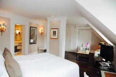 Ein Bett oder Betten in einem Zimmer der Unterkunft Hotel München Palace
