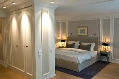 Ein Bett oder Betten in einem Zimmer der Unterkunft Hotel München Palace