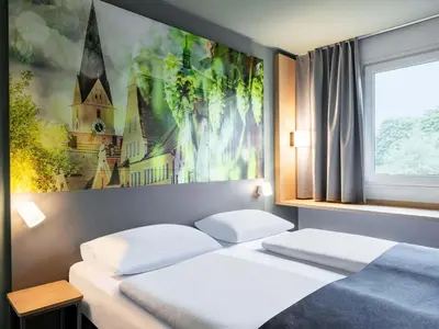 Ein Bett oder Betten in einem Zimmer der Unterkunft B&B Hotel Ingolstadt-Ost