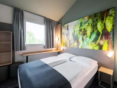 Ein Bett oder Betten in einem Zimmer der Unterkunft B&B Hotel Ingolstadt-Ost