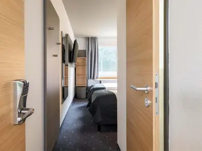 Ein Bett oder Betten in einem Zimmer der Unterkunft B&B Hotel Ingolstadt-Ost