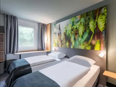 Ein Bett oder Betten in einem Zimmer der Unterkunft B&B Hotel Ingolstadt-Ost