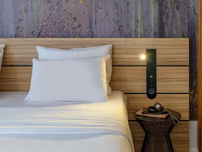 Ein Bett oder Betten in einem Zimmer der Unterkunft Novotel Suites München Parkstadt Schwabing