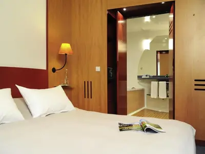 Ein Bett oder Betten in einem Zimmer der Unterkunft Novotel Suites München Parkstadt Schwabing
