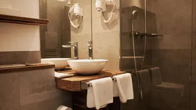 Ein Badezimmer in der Unterkunft Hotel Almwirt
