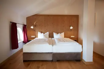Ein Bett oder Betten in einem Zimmer der Unterkunft Hotel Luitpold am See