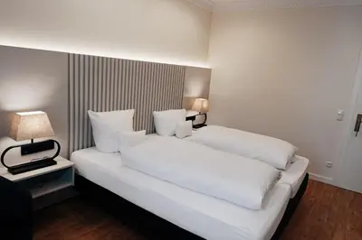 Ein Bett oder Betten in einem Zimmer der Unterkunft Hotel Fletzinger