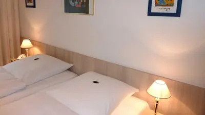 Ein Bett oder Betten in einem Zimmer der Unterkunft Hotel Occam