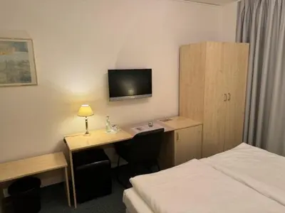 Ein Bett oder Betten in einem Zimmer der Unterkunft Hotel Occam